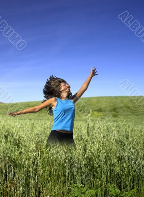 Jumping on a green field