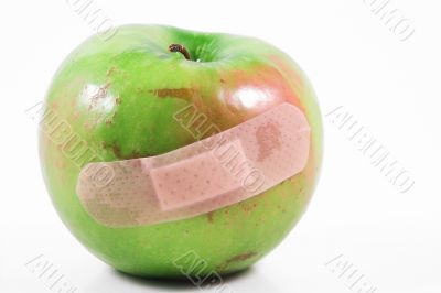 apple with bandaid