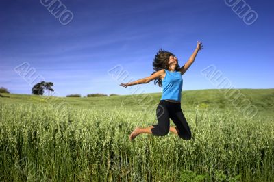 Jumping on a green field