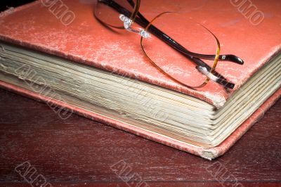 old book and glasses