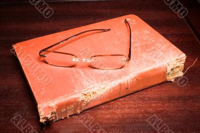 old book and glasses