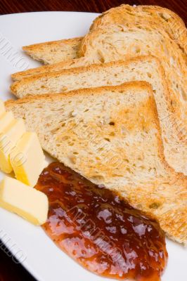 Bread, marmalade and butter, vertical.