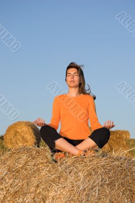 Beautiful woman making yoga