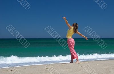 Beautiful woman making poses in the beach