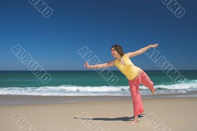 Beautiful woman making poses in the beach