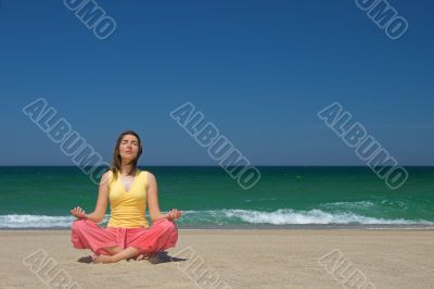 Woman making yoga in the bach