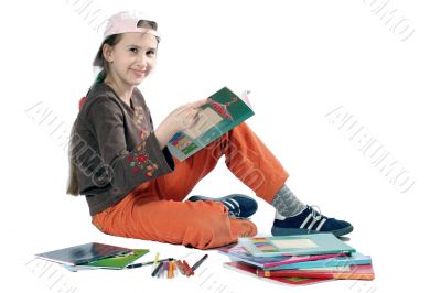 Smiling young girl with books