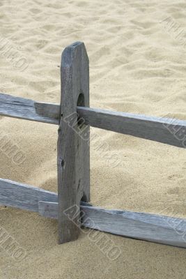 Old wooden fence on a beach