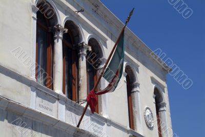 Furled flag on a building in Venice