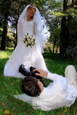 Groom Photographing His Bride