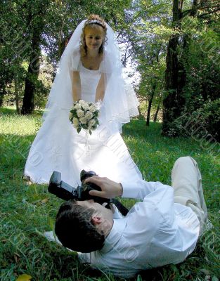 Groom Photographing His Bride