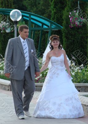 Wedding Pair Walking in Summer Park