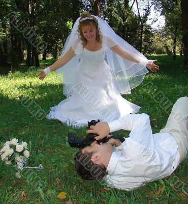 Groom Photographing His Bride