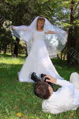 Groom Photographing His Bride