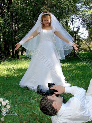 Groom Photographing His Bride