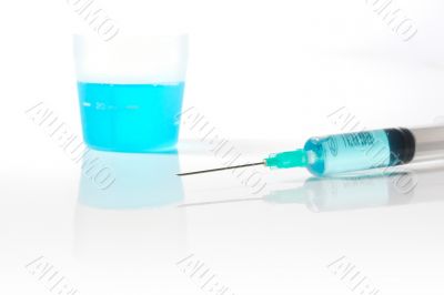 Syringe with blue liquid