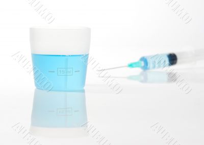 Syringe with blue liquid