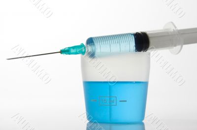 Syringe with blue liquid