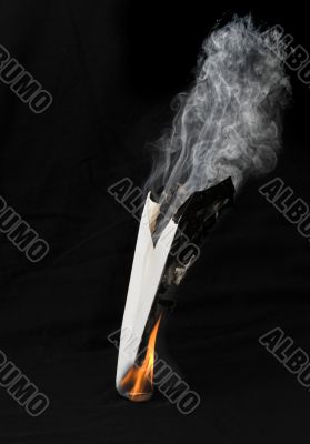 Paper airplane in flames