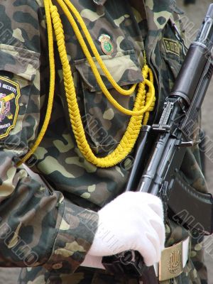 one uniformed weaponed soldier in parade