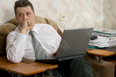 Young the man working on notebook at home