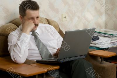 Young the man working on notebook at home