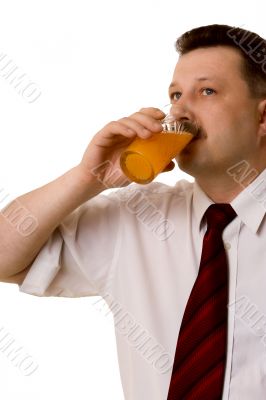 The young man drinking juice on a white background