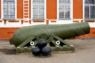 Old artillery piece with shells