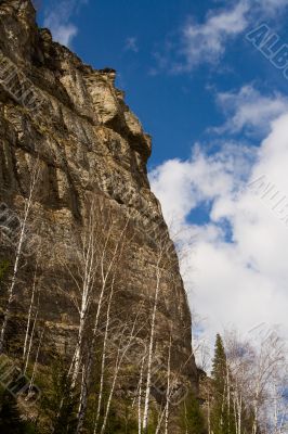 Rocky rock on a background of the sky