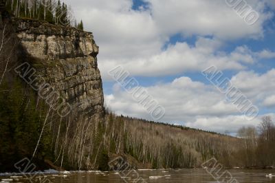 Rocky rock on a background of the sky