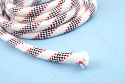 white rope isolated on blue close-ups