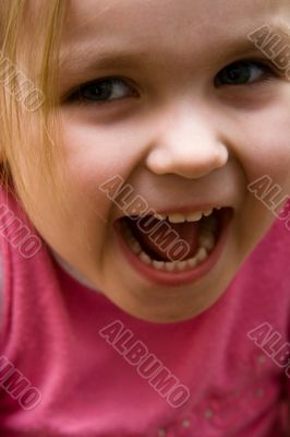 The small shouting girl close up