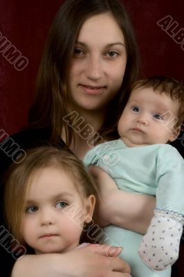 Young mum with the son and the daughter