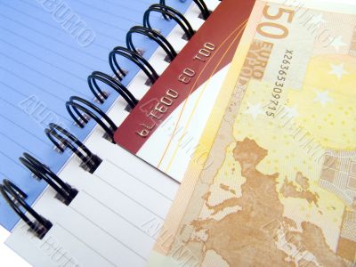 Notebook with Euro and a credit card