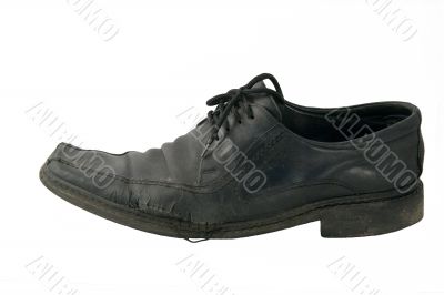 The old torn shoe on a white background