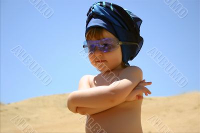 Girl in blue sunglasses & hadscarf