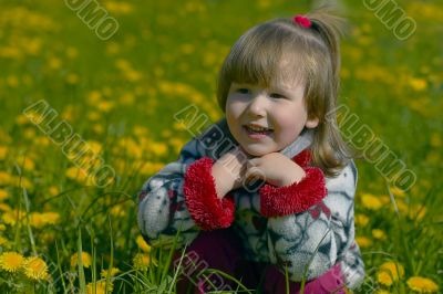 Smiling dirl in dandelion field