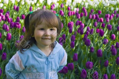 Happy girl in tulips