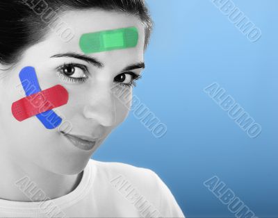 Woman with bandages on the face