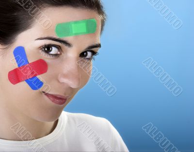 Woman with bandages on the face