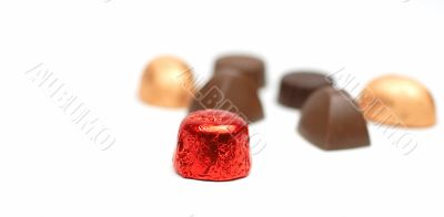 Fancy chocolates over white background