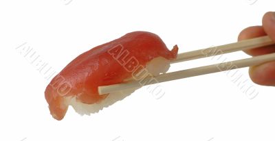 Tuna sushi in chopsticks