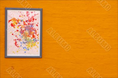 abstract painting and orange wall