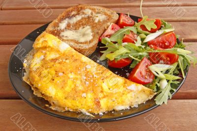 omelette, salad and buttered toast