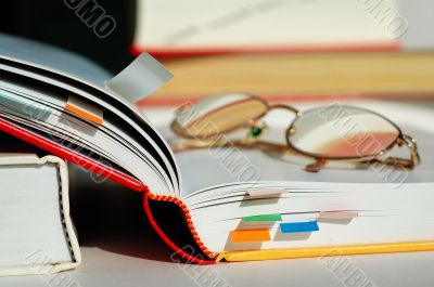 Opened book and glasses