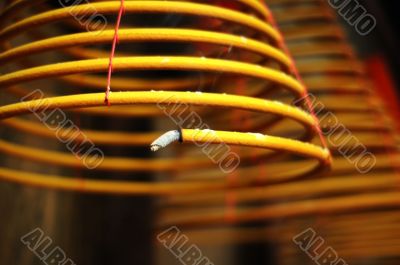 Buring incense coil