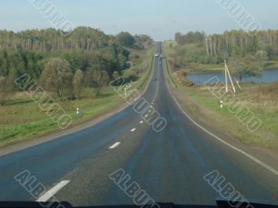 Autumn road with deep blue sky