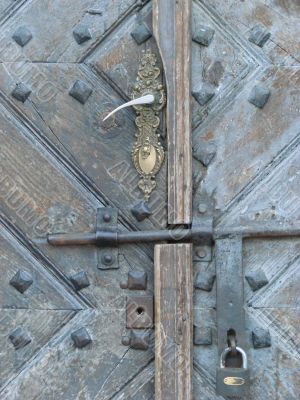 Aged door lock on wooden door