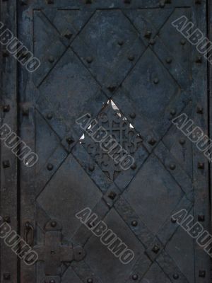 Aged door lock on wooden door