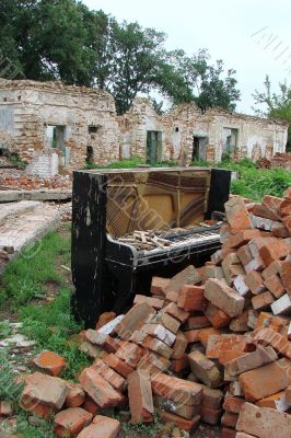 The Old Broken Piano Among Ruins